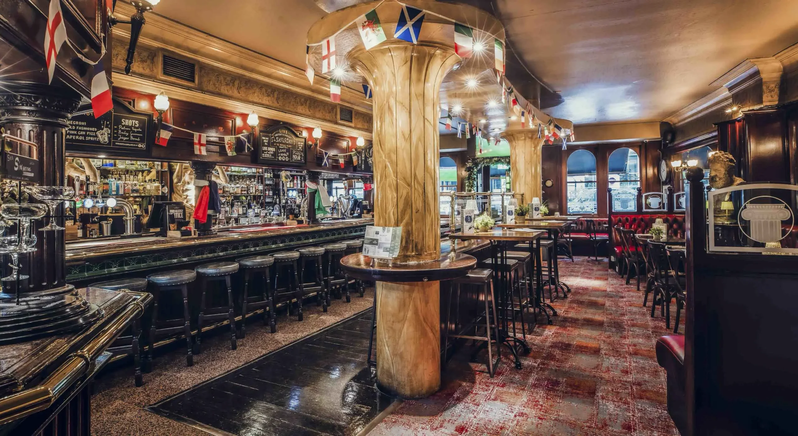 The bar interior at The Hercules Pillars, a traditional pub in Holborn on Great Queen Street, London