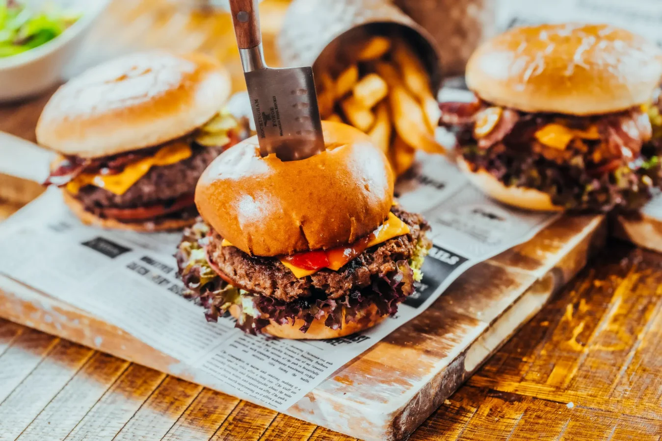 Stacked beef burgers with cheese and fries served at The Hercules Pillars pub on Great Queen Street