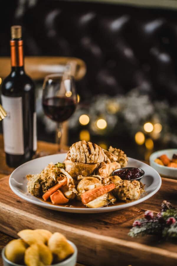 Gourmet meal with seafood, vegetables, and wine at Hercules Pillars.