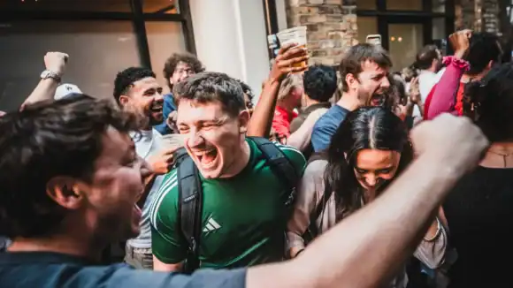 Group of people enjoying a lively celebration at The Hercules Pillars pub.