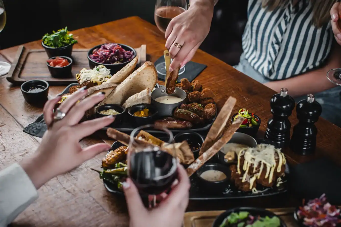 Sharing a variety of gourmet dishes and drinks at The Hercules Pillars pub.