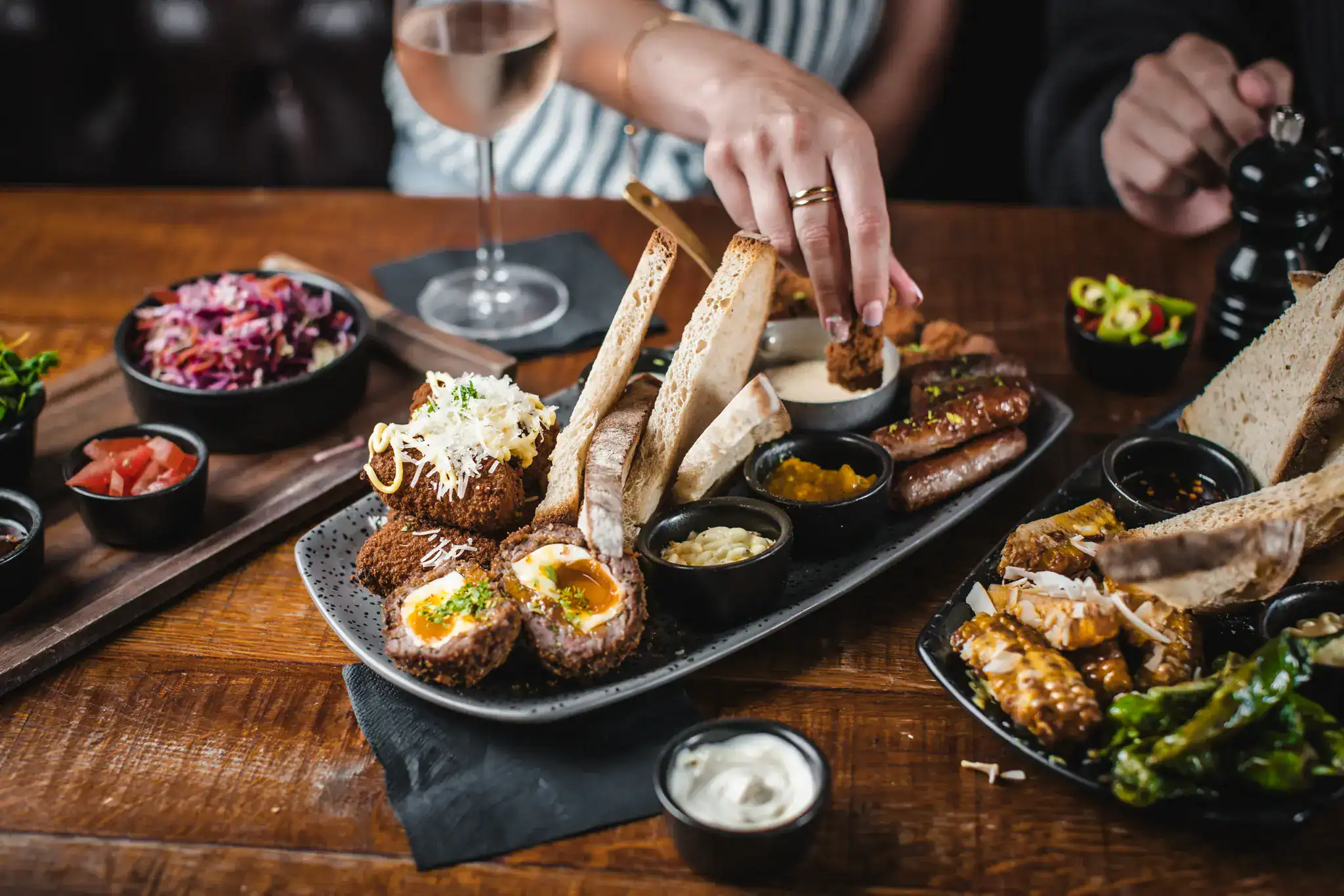 Delicious assorted meat platter with sides and bread at Hercules Pillars.