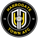 Harrogate Town AFC emblem featuring a white rose and black and yellow colours.